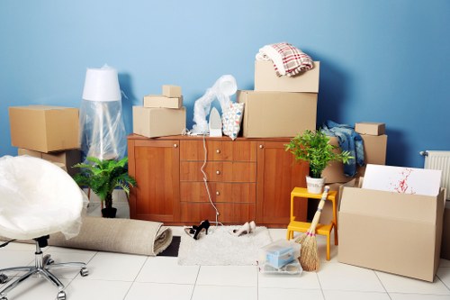 Removal van and moving boxes in a Clapham residential street