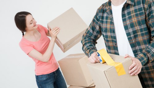 Supervised moving team using protective equipment during a relocation
