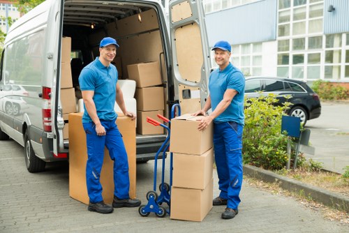Local furniture pick-up team handling removal in a Clapham flat