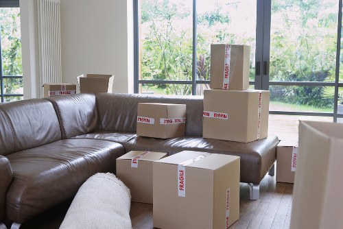 Professional movers handling stairs in a Clapham property