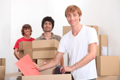 Furniture and boxes being loaded into a removals van